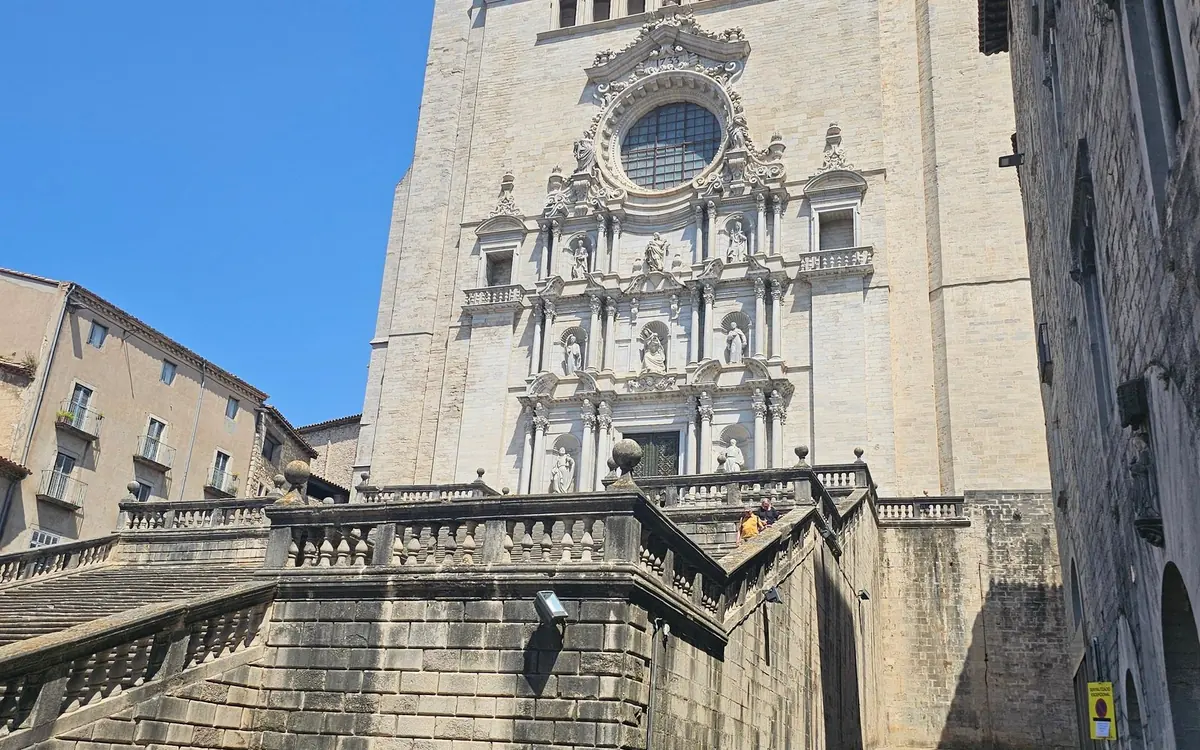 The carved stone front of Girona cathedral above its wide flight of steps