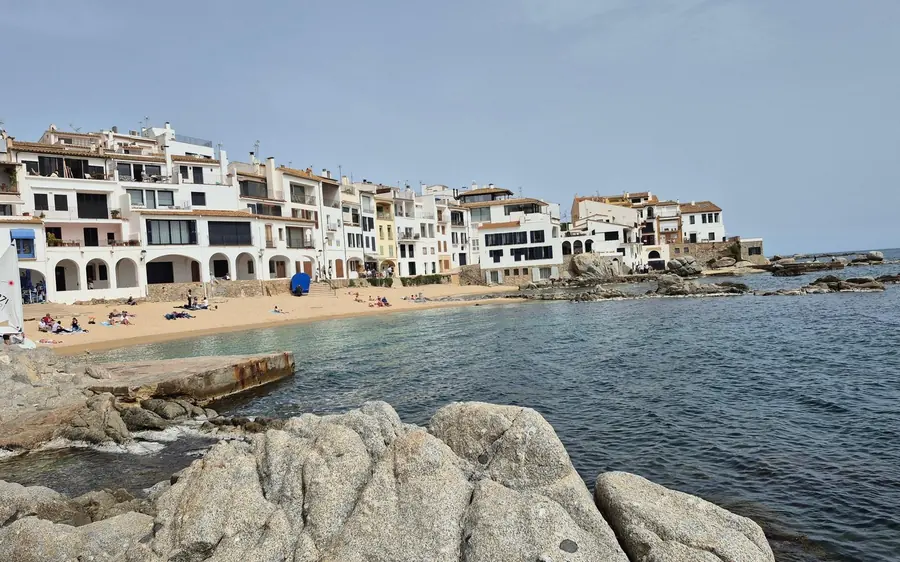 Whitewashed village houses standing right on the beach